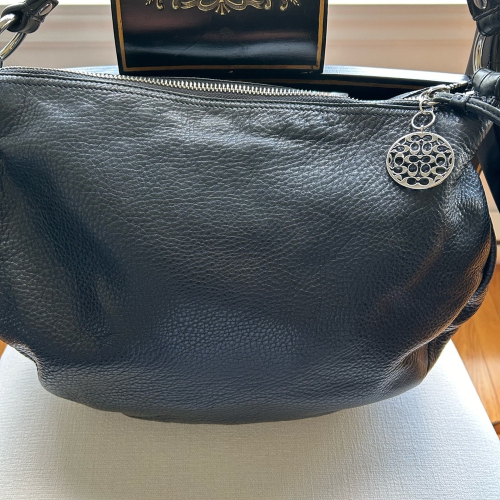 Coach Black Pebbled Leather Shoulder Bag
Measurements 13”Dx 16” W x 3” gusset